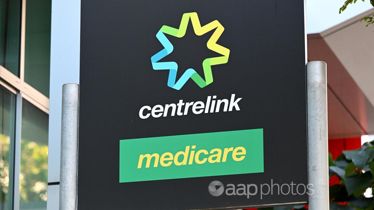 A sign with the words Centrelink and Medicare