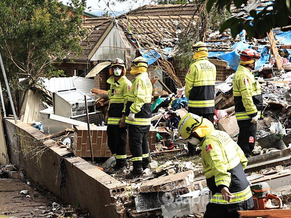 Fire Rescue personnel after the explosion of a townhouse