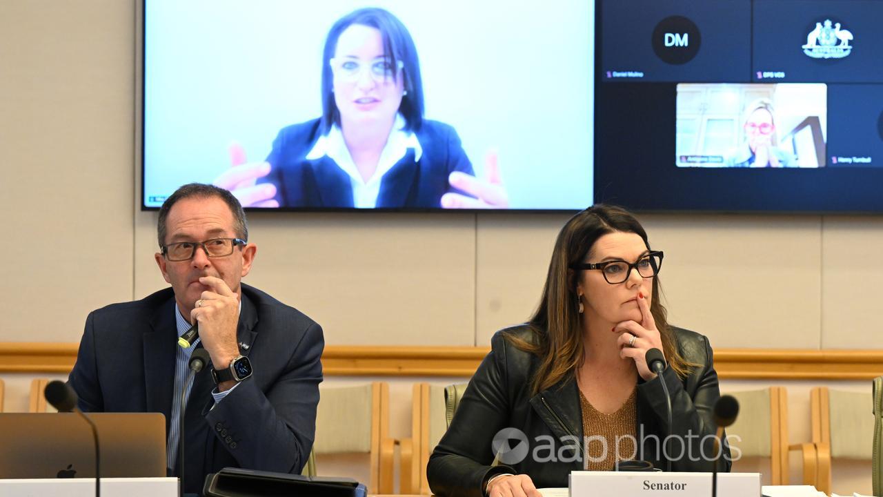 Mia Garlick (on screen) at the inquiry (file image)