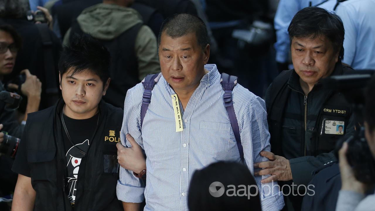 Hong Kong media magnate Jimmy Lai is taken away by police